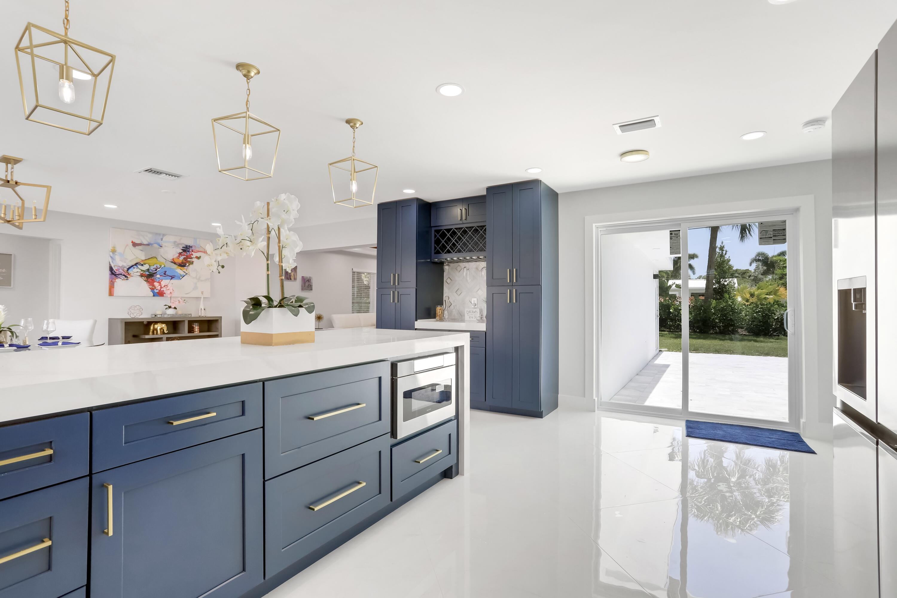 324 Bamboo Road Palm Beach Shores, FL 33404 - Photo 38 of 59 a spacious bathroom with a sink a large mirror and a shower
