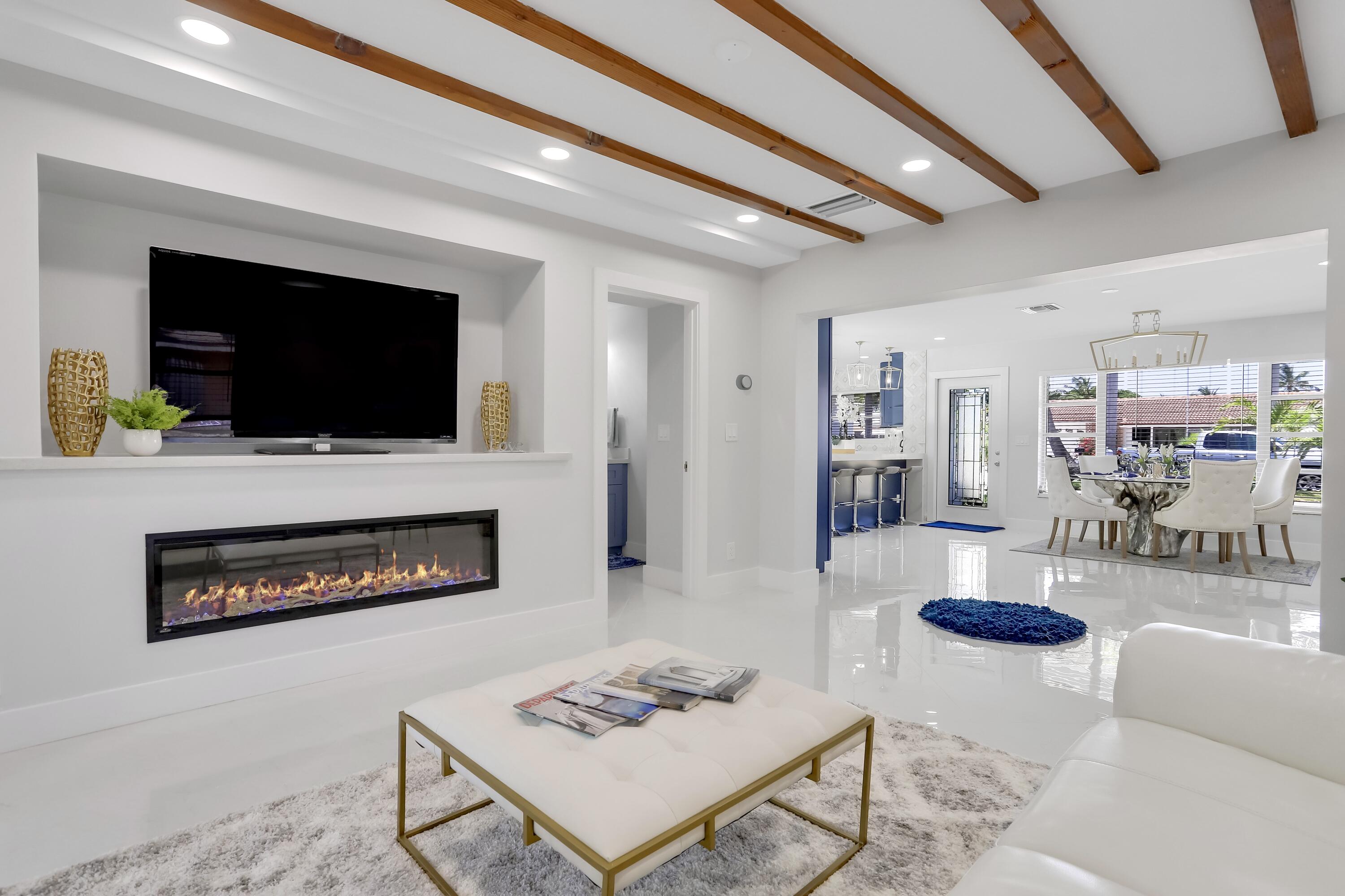 324 Bamboo Road Palm Beach Shores, FL 33404 - Photo 39 of 59 a living room with furniture and a flat screen tv