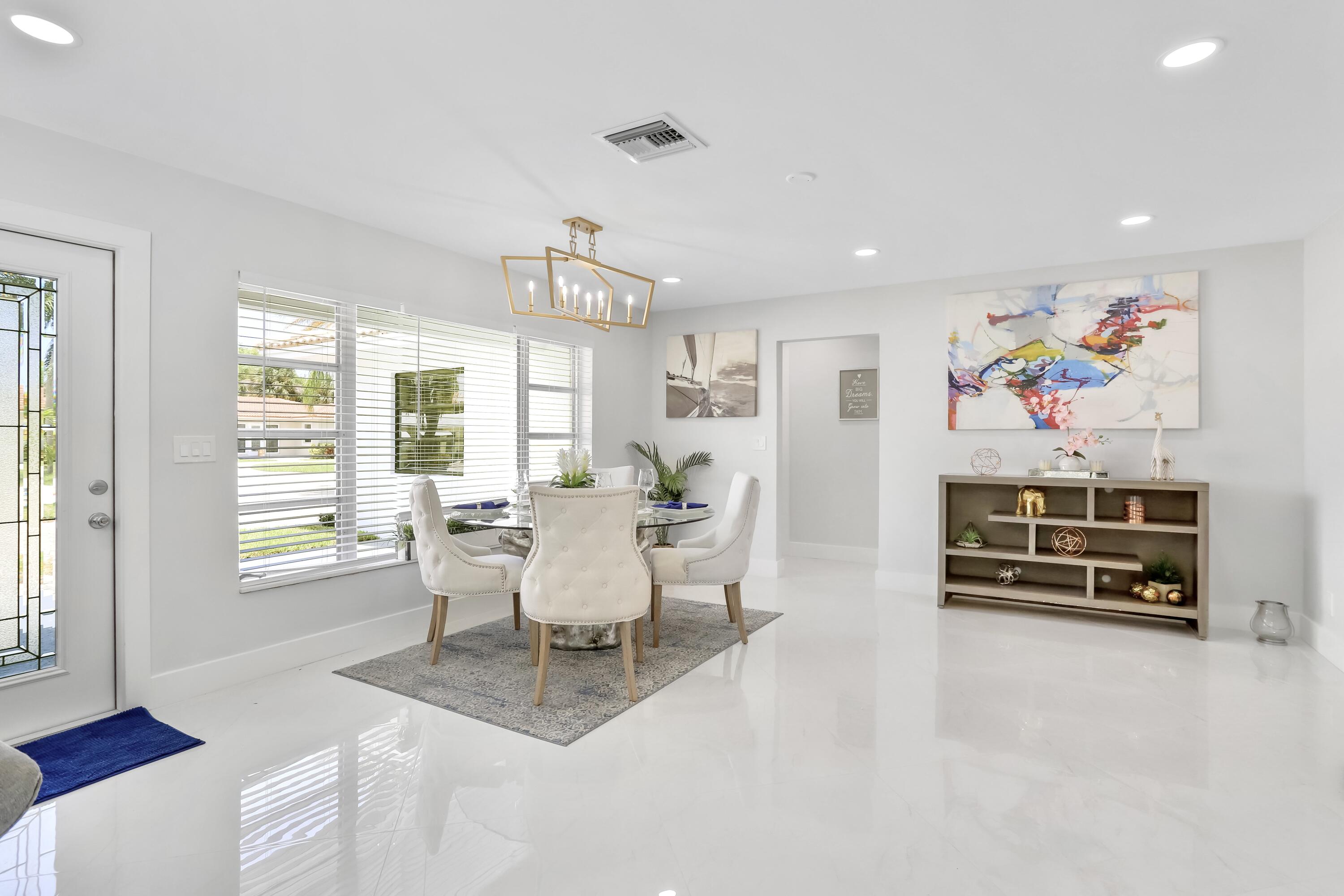 324 Bamboo Road Palm Beach Shores, FL 33404 - Photo 42 of 59 a living room with furniture a flat screen tv and a window