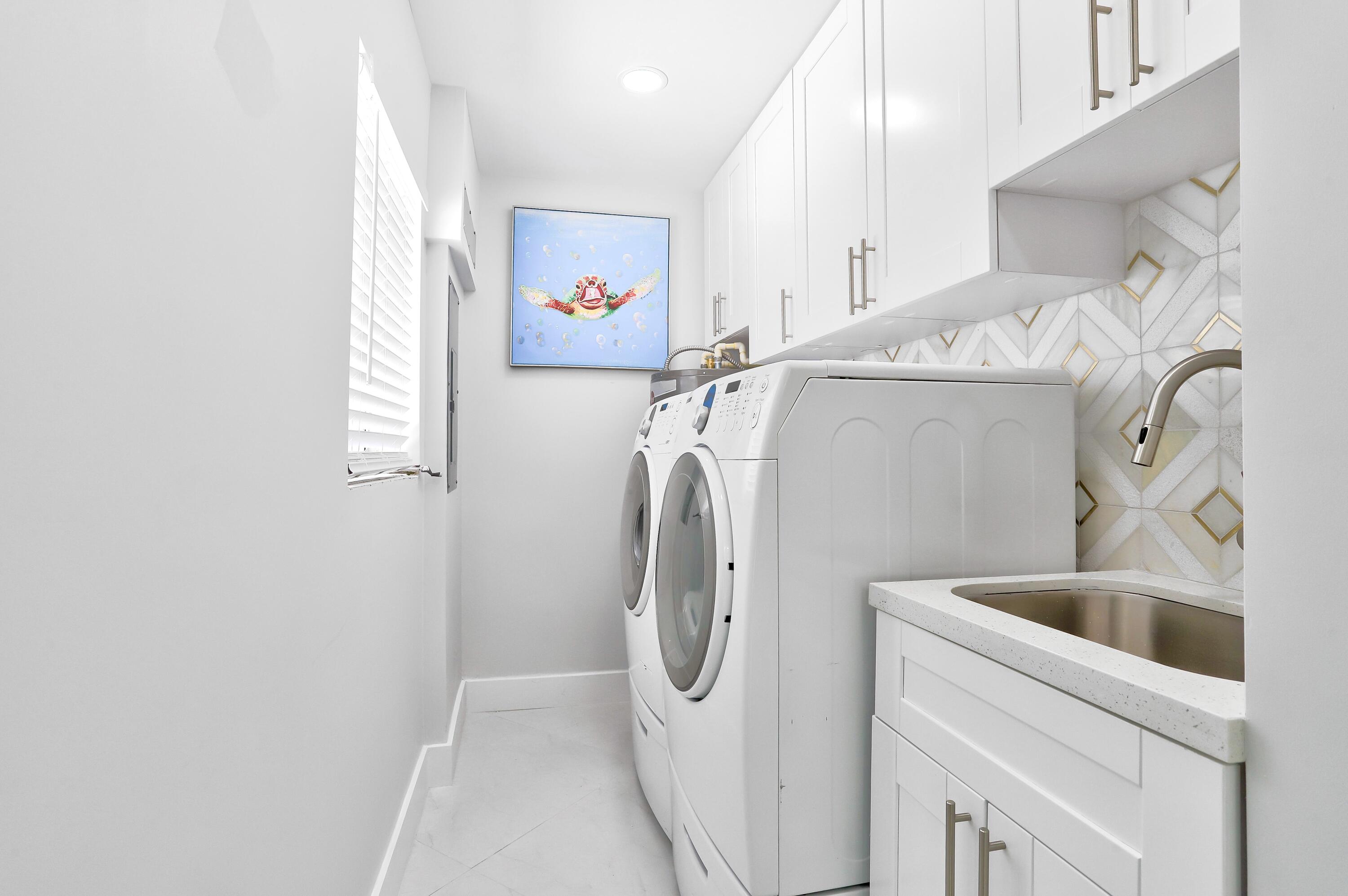 324 Bamboo Road Palm Beach Shores, FL 33404 - Photo 47 of 59 a utility room with dryer and washer
