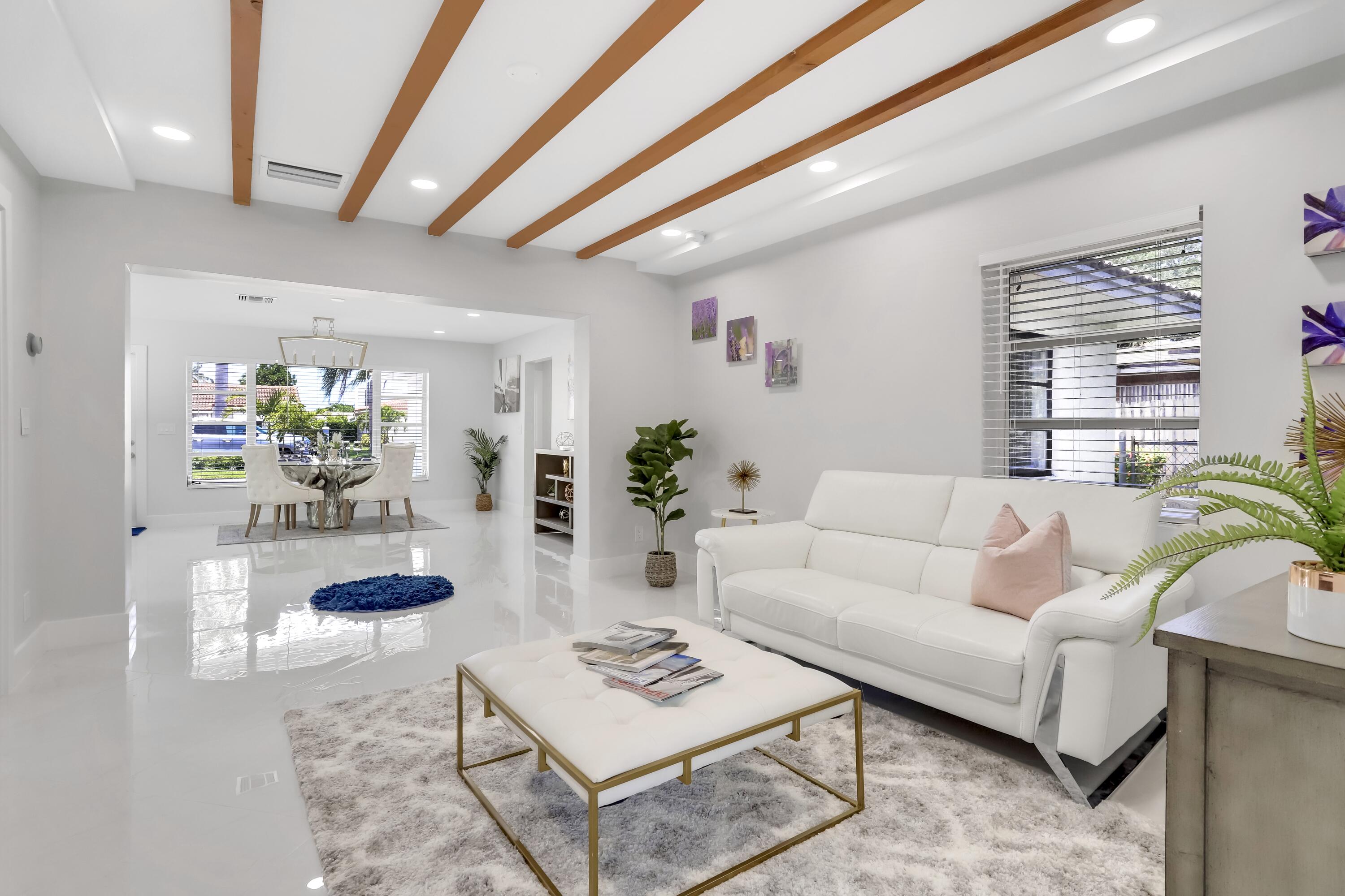 324 Bamboo Road Palm Beach Shores, FL 33404 - Photo 7 of 59 a living room with furniture and a table