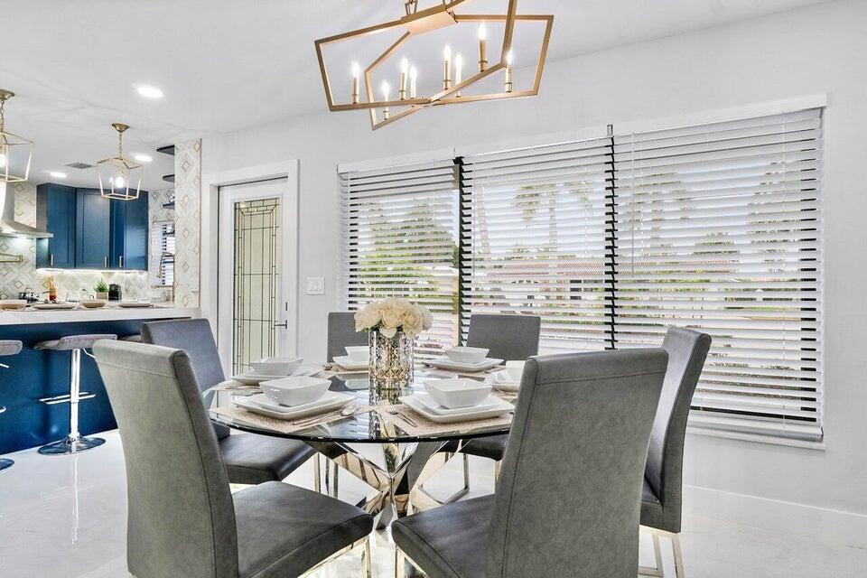 324 Bamboo Road Palm Beach Shores, FL 33404 - Photo 10 of 59 a view of a dining room with furniture and window