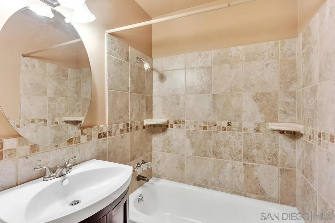 9517 Abbeyfield Road Santee, CA 92071 - Photo 16 of 42 a bathroom with a sink shower and a bathtub
