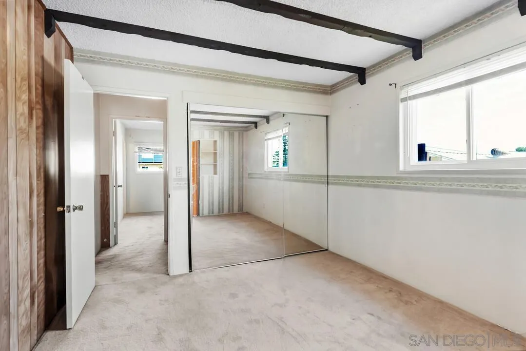 9517 Abbeyfield Road Santee, CA 92071 - Photo 20 of 42 a view of a hallway with wooden shelves