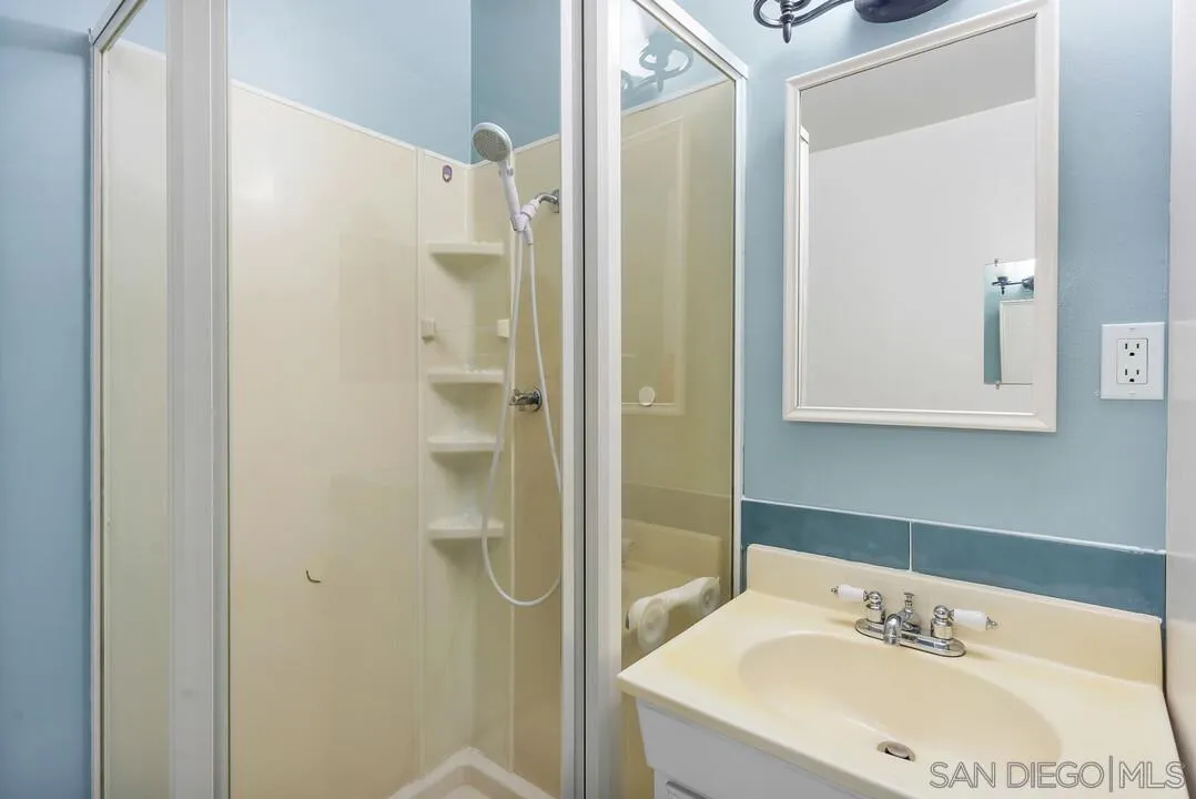 9517 Abbeyfield Road Santee, CA 92071 - Photo 25 of 42 a bathroom with a sink and a mirror