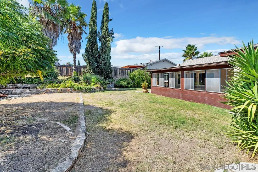 9517 Abbeyfield Road Santee, CA 92071 - Photo 29 of 42 a view of a house with a yard