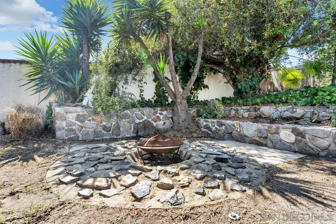 9517 Abbeyfield Road Santee, CA 92071 - Photo 30 of 42 a backyard of a house with fountain table and chairs