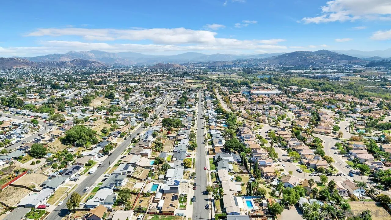 9517 Abbeyfield Road Santee, CA 92071 - Photo 40 of 42 an aerial view of residential houses with outdoor space and trees