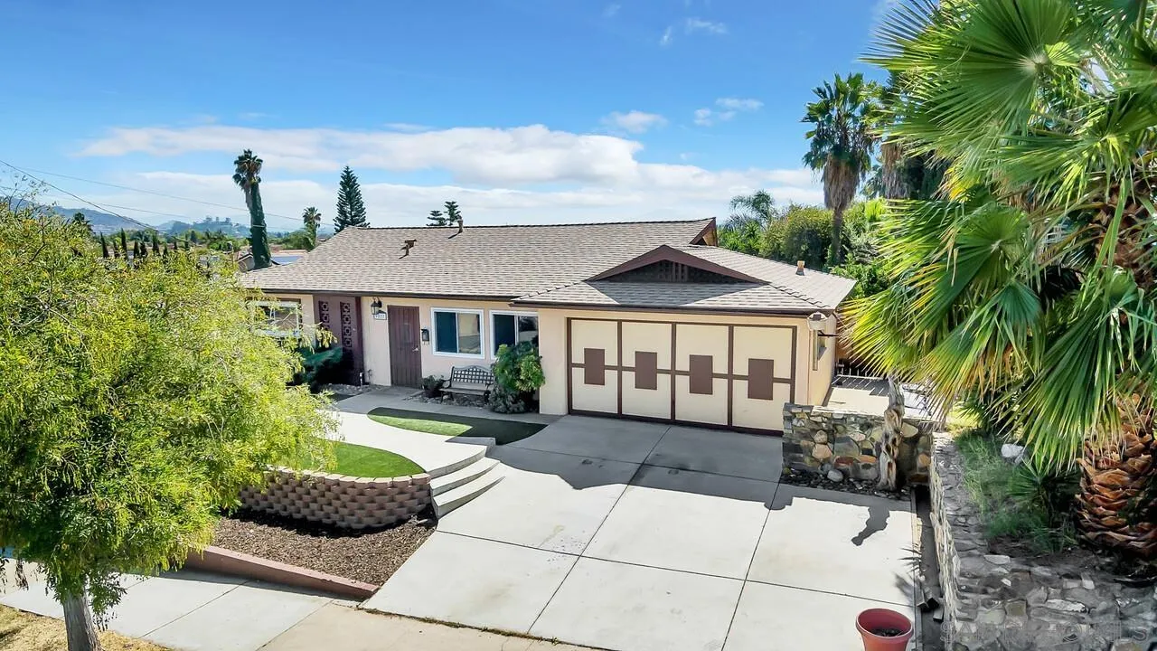 9517 Abbeyfield Road Santee, CA 92071 - Photo 42 of 42 a front view of a house with a garden