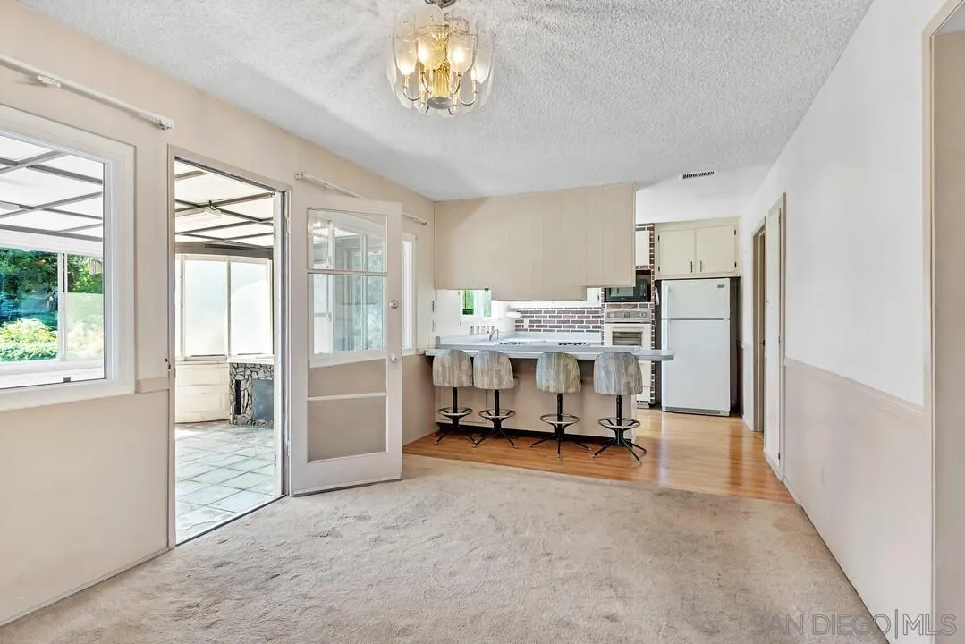9517 Abbeyfield Road Santee, CA 92071 - Photo 7 of 42 a bedroom with furniture and a large window