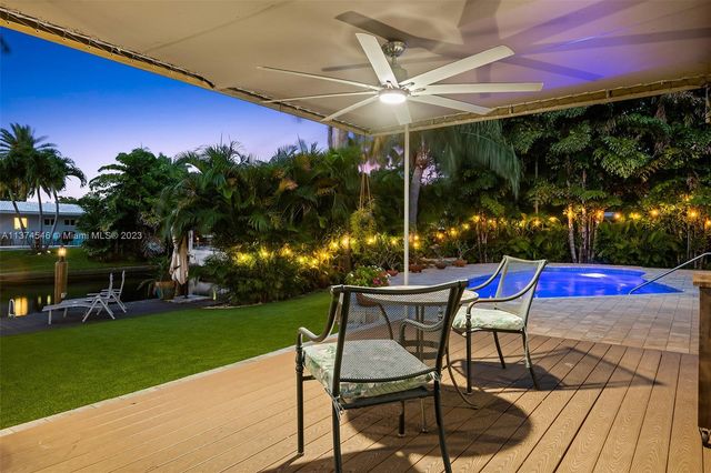 a view of a backyard with sitting area