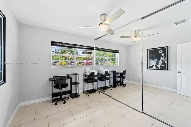 a view of a workspace with furniture