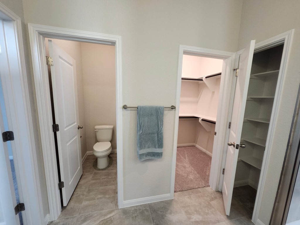 320 Creek Road, Unit 202 Dripping Springs, TX 78620 - Photo 11 of 26 a bathroom with a sink and toilet
