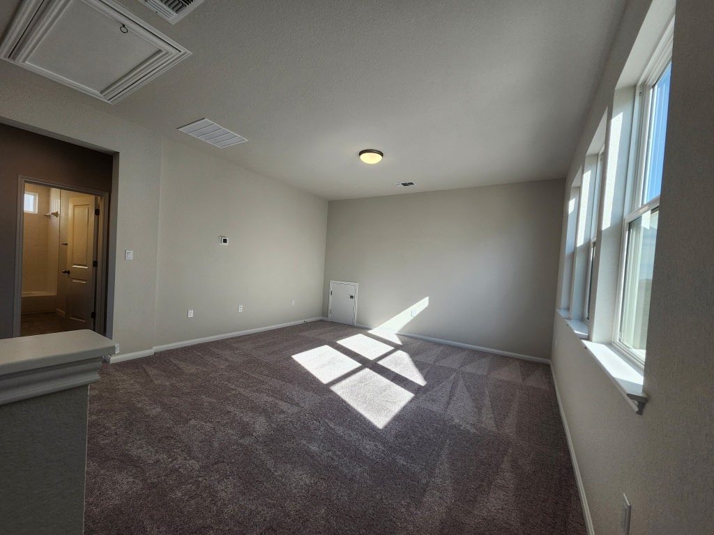 320 Creek Road, Unit 202 Dripping Springs, TX 78620 - Photo 16 of 26 a very nice looking room with a window