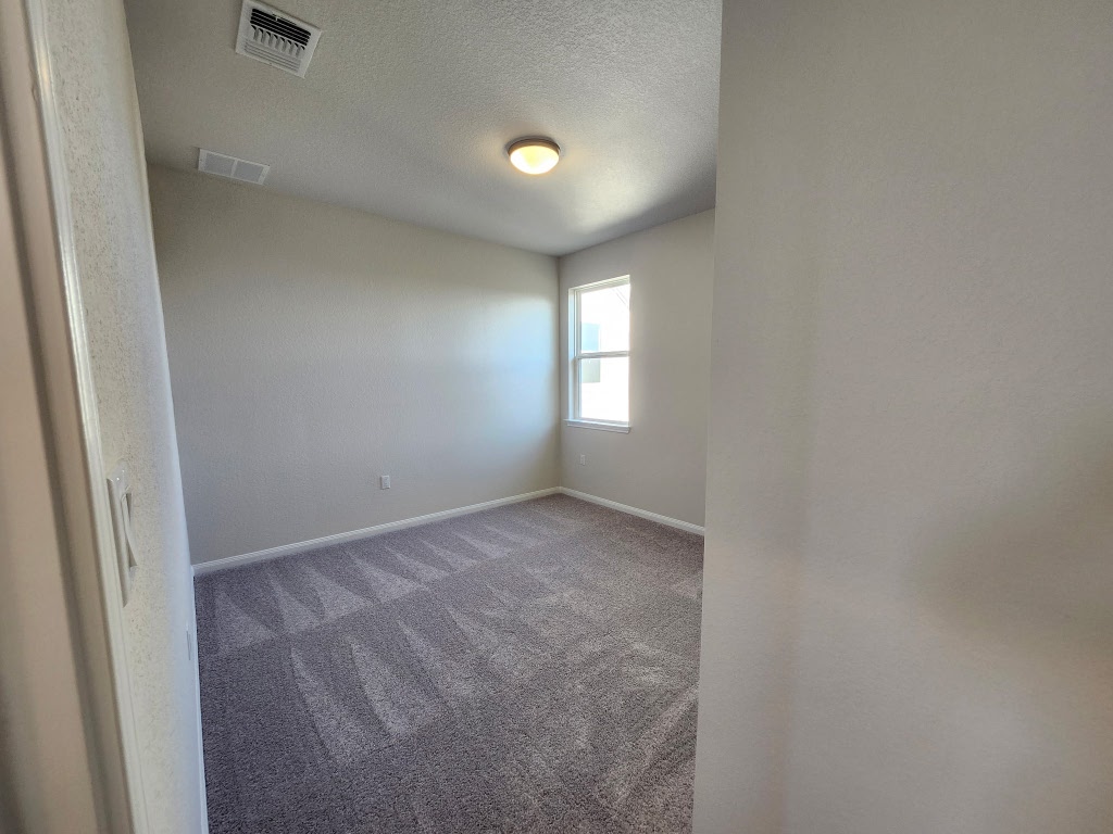 320 Creek Road, Unit 202 Dripping Springs, TX 78620 - Photo 20 of 26 a view of an empty room and window