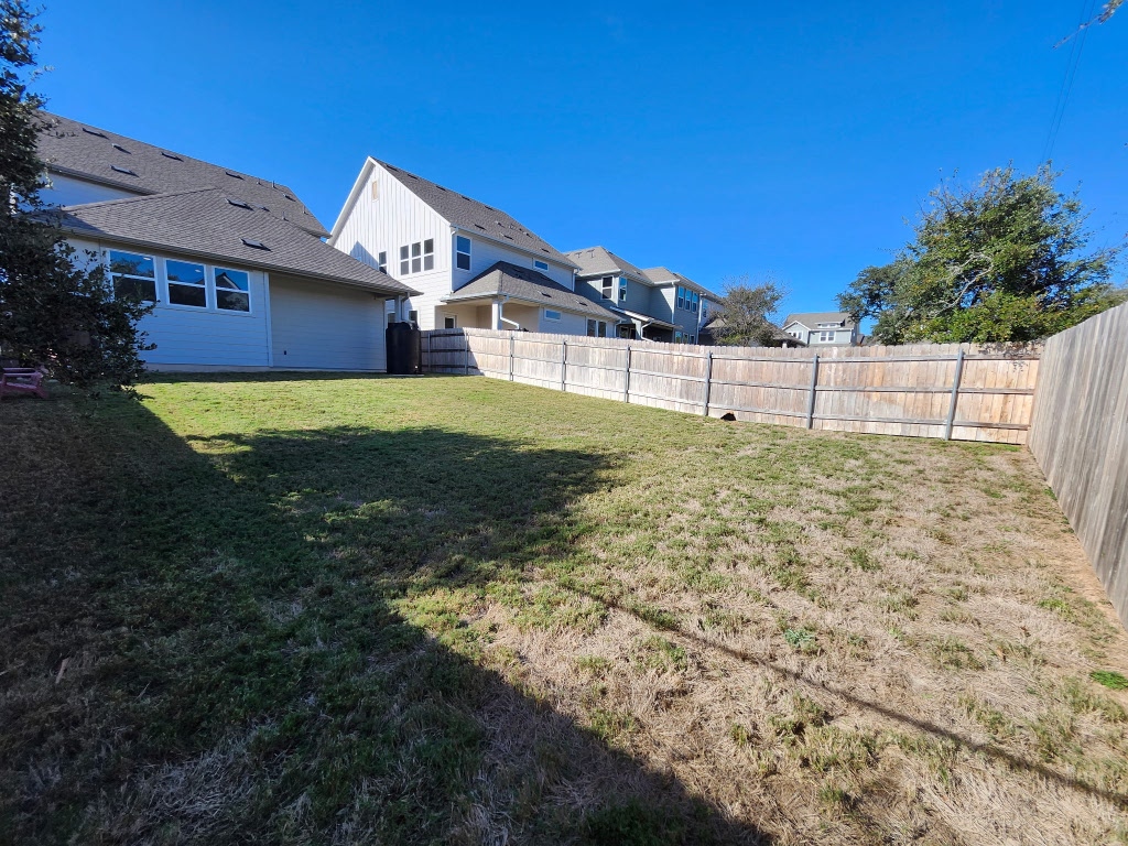 320 Creek Road, Unit 202 Dripping Springs, TX 78620 - Photo 25 of 26 a view of a house with a yard