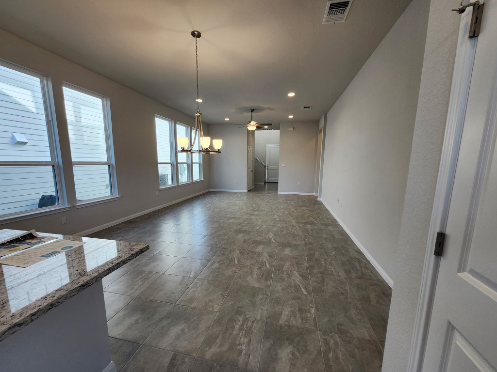 320 Creek Road, Unit 202 Dripping Springs, TX 78620 - Photo 3 of 26 wooden floor in an empty room with a window