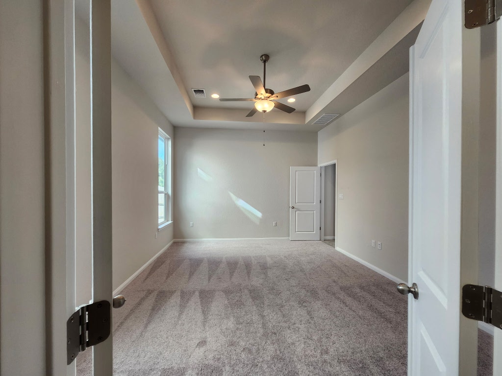 320 Creek Road, Unit 202 Dripping Springs, TX 78620 - Photo 9 of 26 wooden floor in an empty room with a window