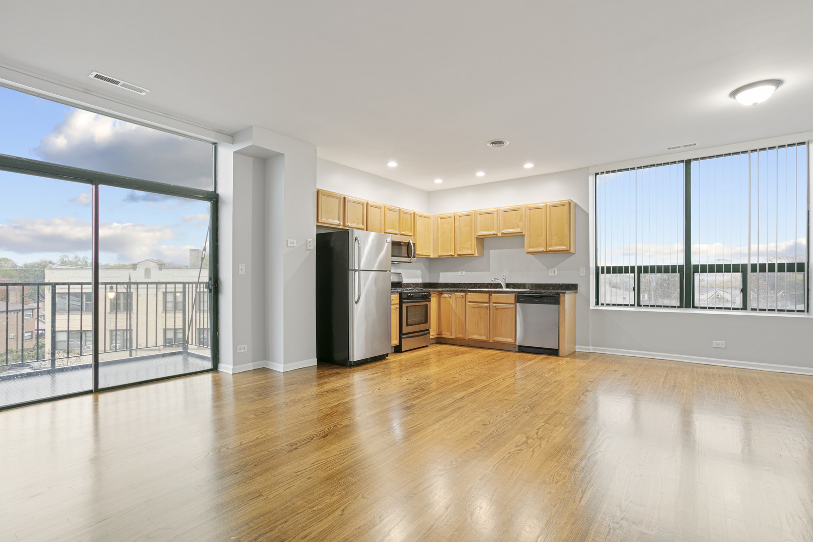 2451 West Howard Street, Unit 401 Chicago, IL 60645 - Photo 2 of 14 a view of large kitchen with a sink and refrigerator