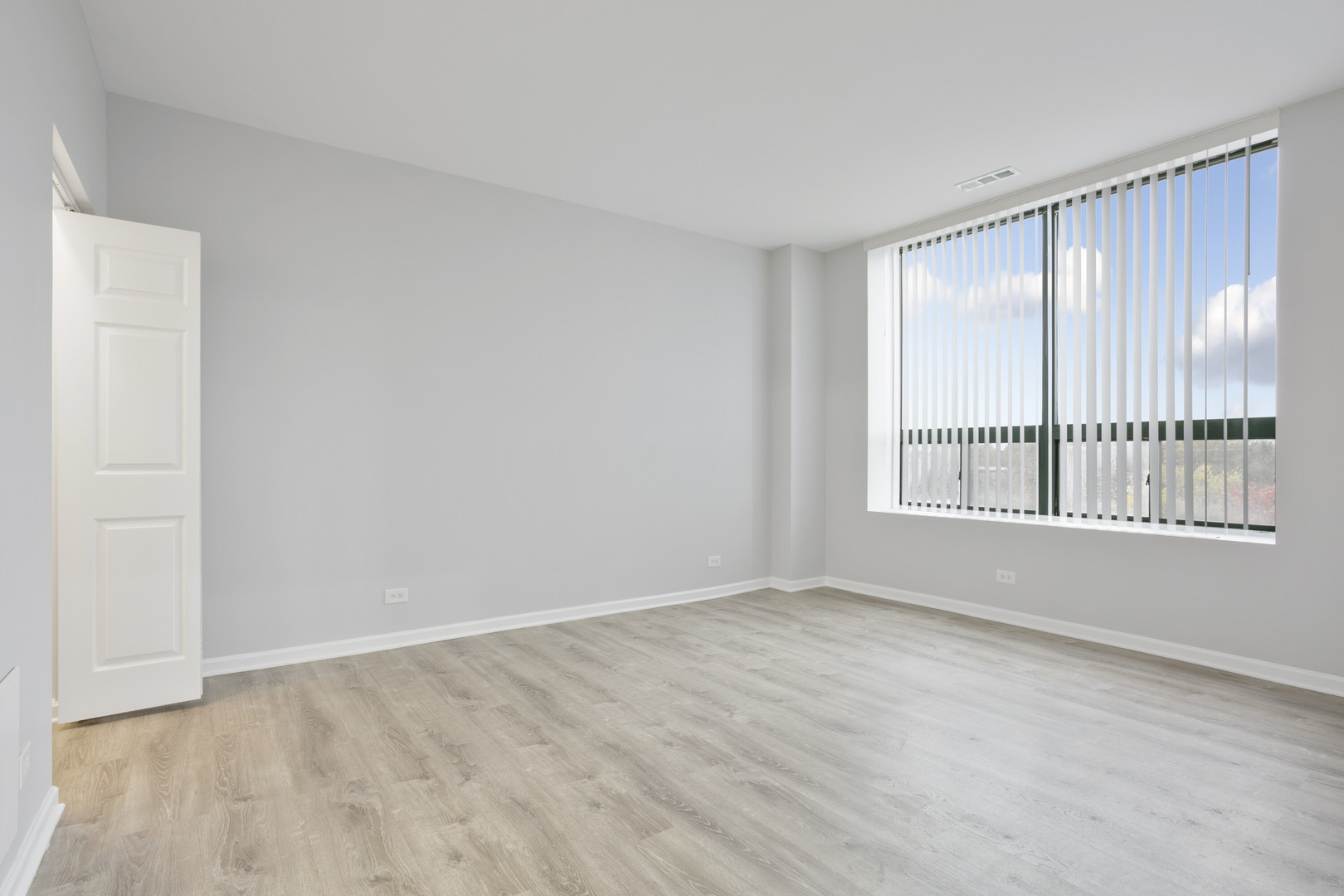 2451 West Howard Street, Unit 401 Chicago, IL 60645 - Photo 6 of 14 a view of an empty room with a window