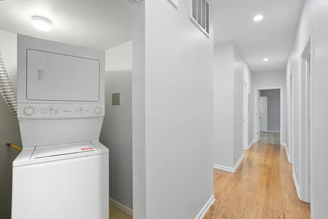 a view of storage and utility room with washer and dryer