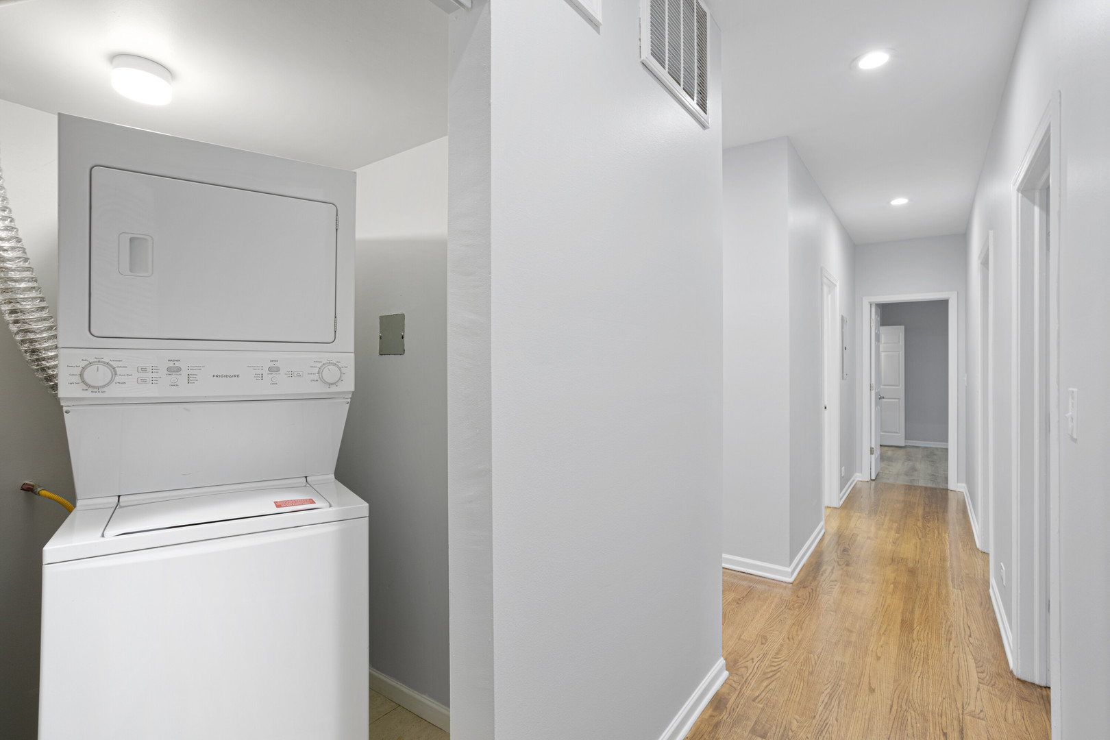 2451 West Howard Street, Unit 401 Chicago, IL 60645 - Photo 9 of 14 a view of storage and utility room with washer and dryer