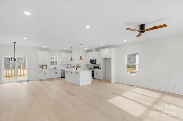 a view of a kitchen with appliances and cabinets
