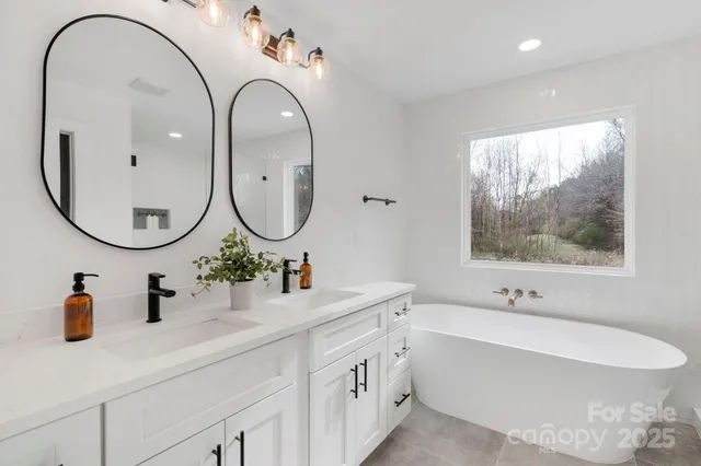 a bathroom with a granite countertop sink a toilet and shower