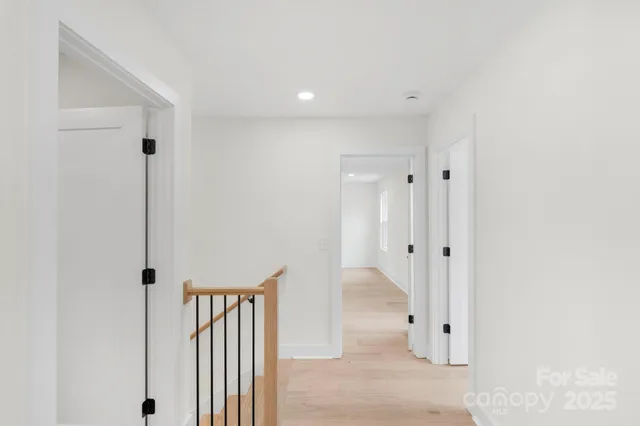 a view of a bathroom with a sink and a mirror