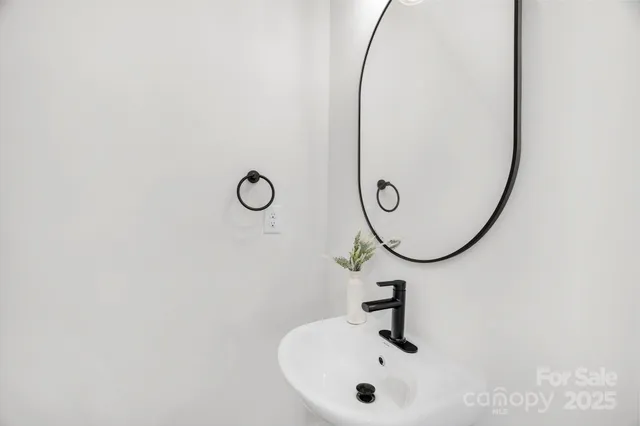 a backyard of a house with a table and chairs