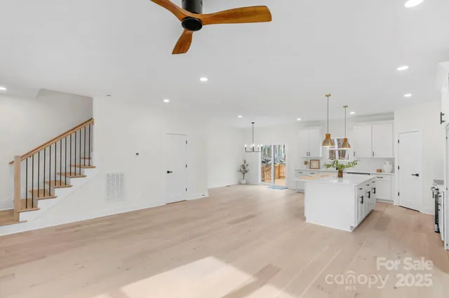 a view of a living room and kitchen