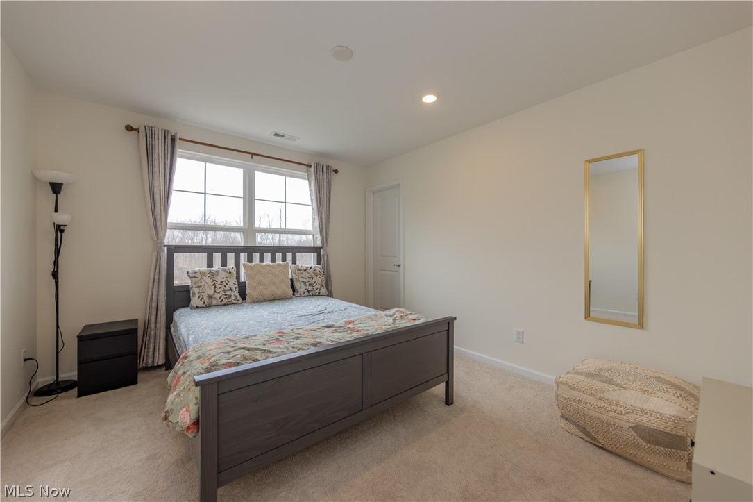 766 River Run Road Aurora, OH 44202 - Photo 32 of 49 Bedroom with light carpet and recessed lighting