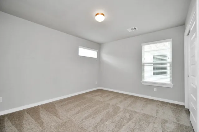 a view of a house with a yard and pathway