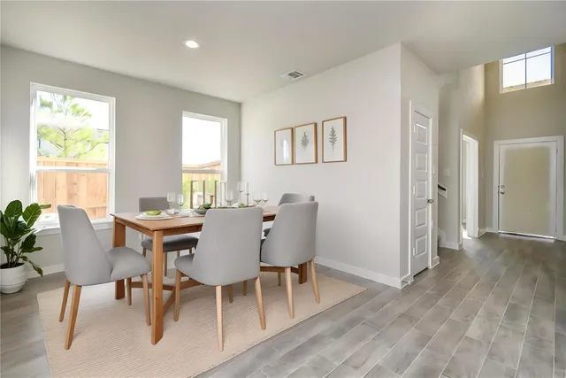 a large white kitchen with a large window