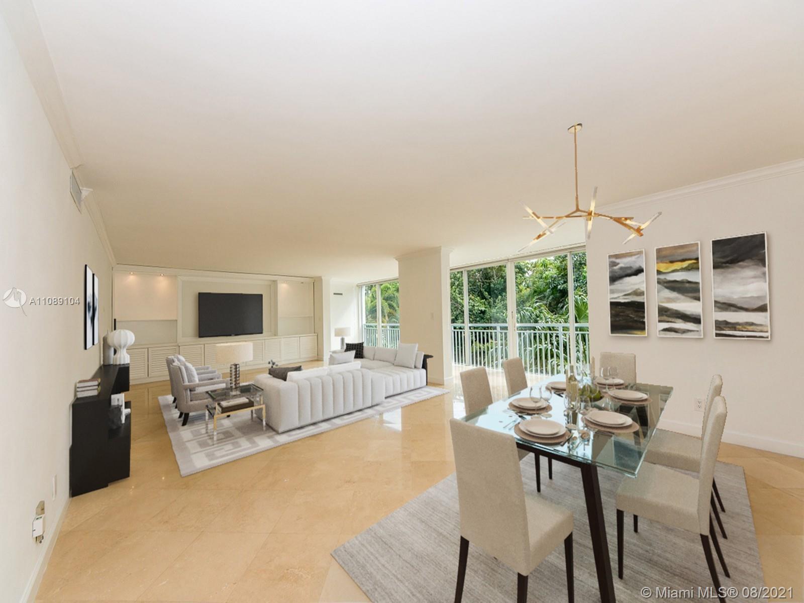 605 Ocean Drive, Unit 2L Key Biscayne, FL 33149 - Photo 2 of 18 a living room with furniture and a large window