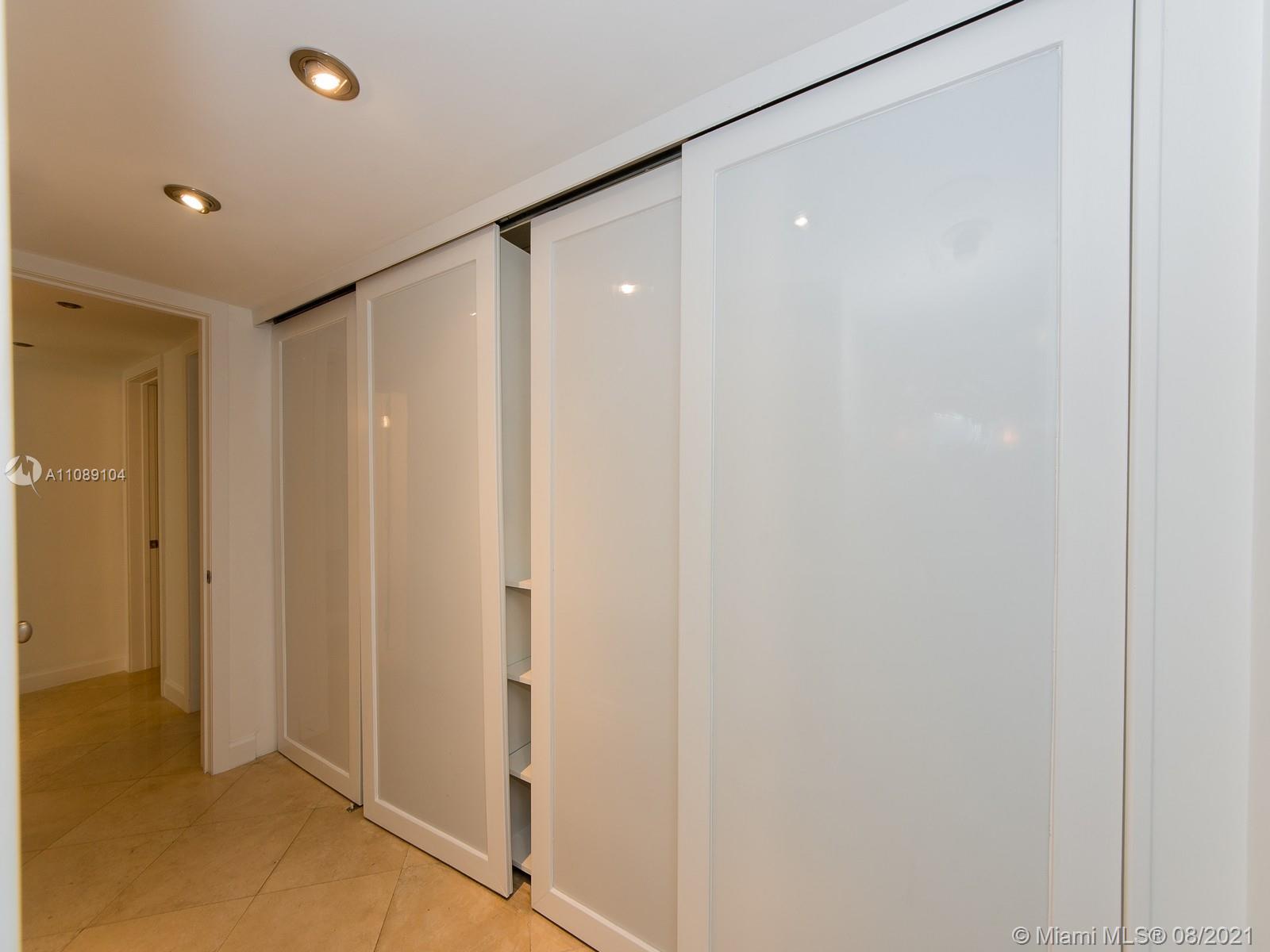 605 Ocean Drive, Unit 2L Key Biscayne, FL 33149 - Photo 12 of 18 a bathroom with a shower and a glass door