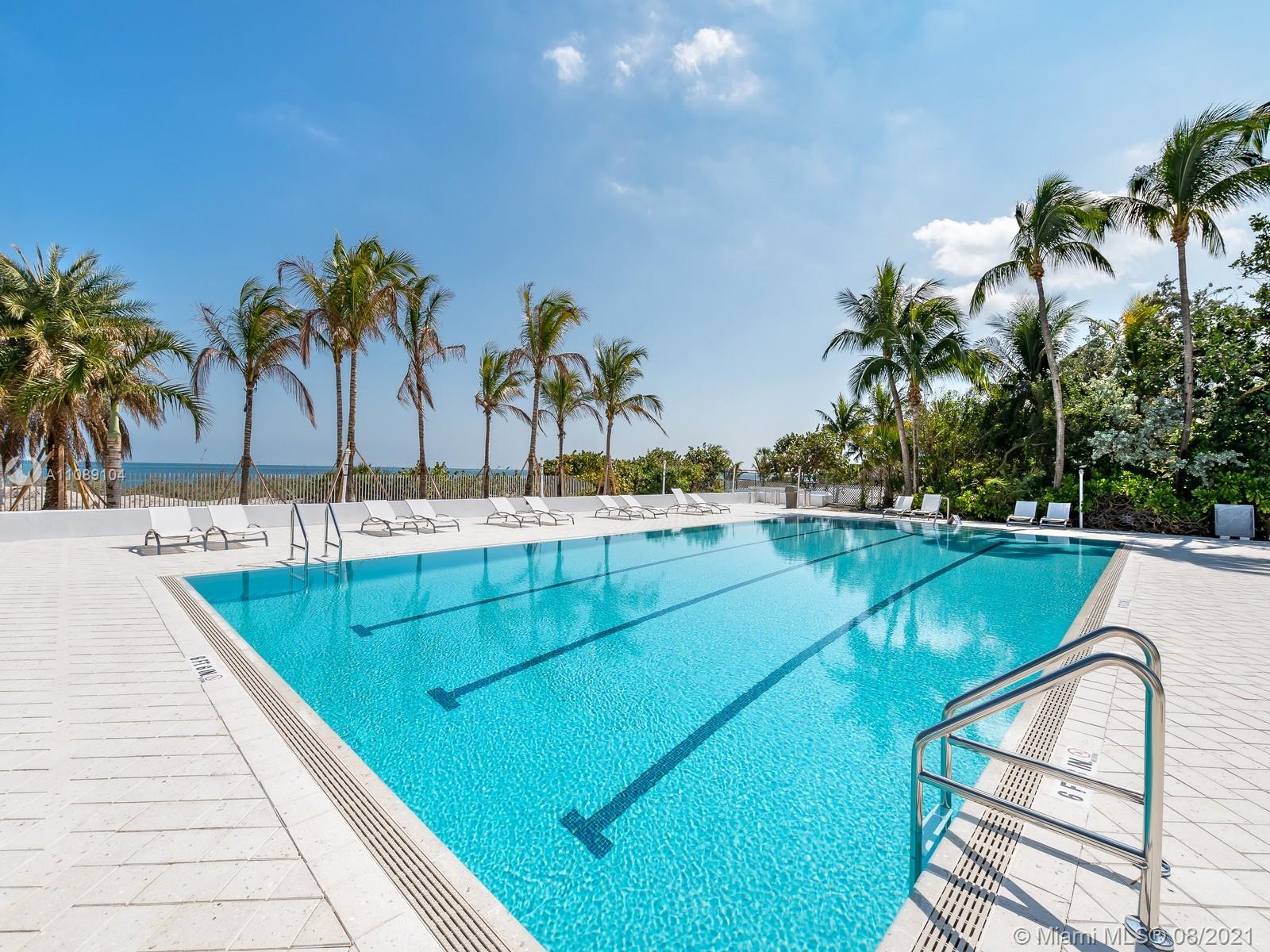 605 Ocean Drive, Unit 2L Key Biscayne, FL 33149 - Photo 17 of 18 a view of swimming pool with chairs