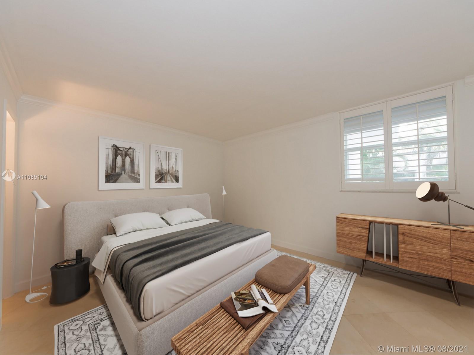 605 Ocean Drive, Unit 2L Key Biscayne, FL 33149 - Photo 6 of 18 a bedroom with a bed and a window