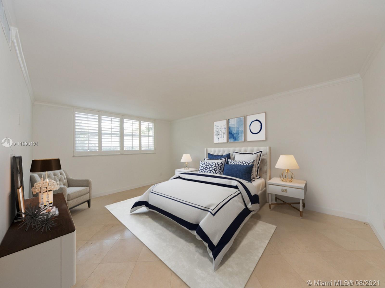 605 Ocean Drive, Unit 2L Key Biscayne, FL 33149 - Photo 7 of 18 a bedroom with a bed and window