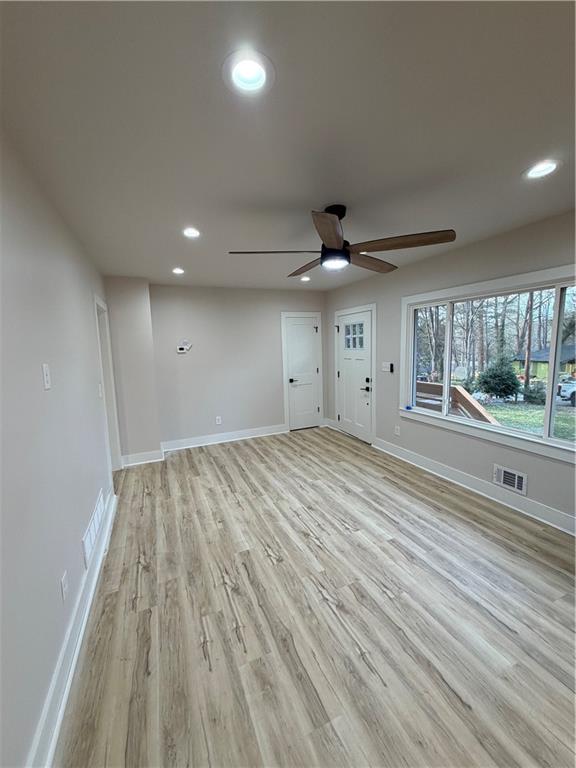 3119 Bellgreen Way Decatur, GA 30032 - Photo 3 of 13 an empty room with wooden floor and windows