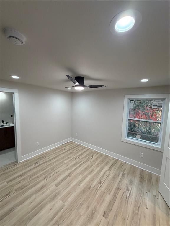 3119 Bellgreen Way Decatur, GA 30032 - Photo 8 of 13 an empty room with wooden floor fan and windows