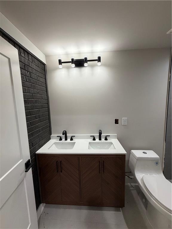 3119 Bellgreen Way Decatur, GA 30032 - Photo 9 of 13 a bathroom with a sink and a toilet