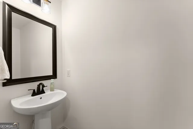 a view of storage and utility room with washer and dryer