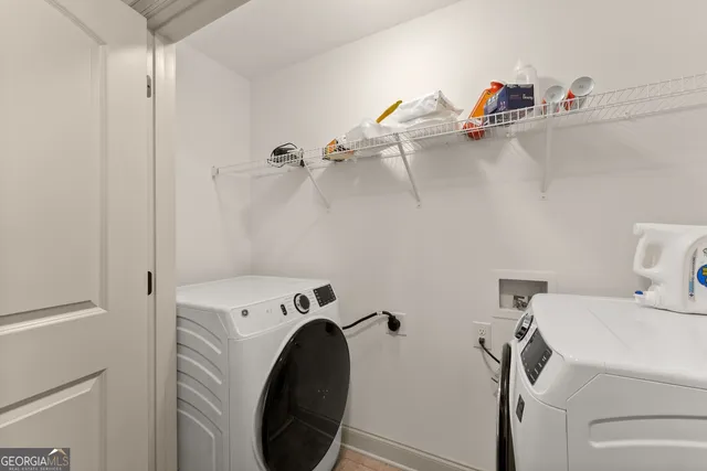 a bedroom with a bed and a ceiling fan