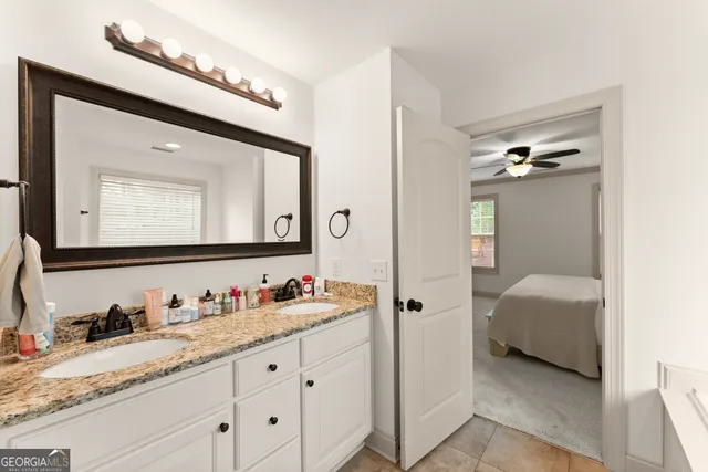 an empty room with windows and cabinet