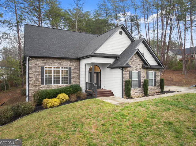 a view of house with yard