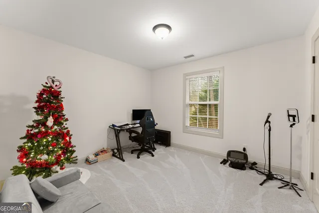 a view of a livingroom with furniture