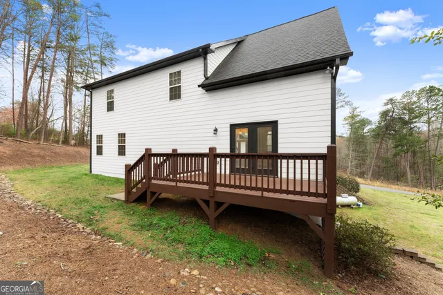 a balcony with wooden floor and fence