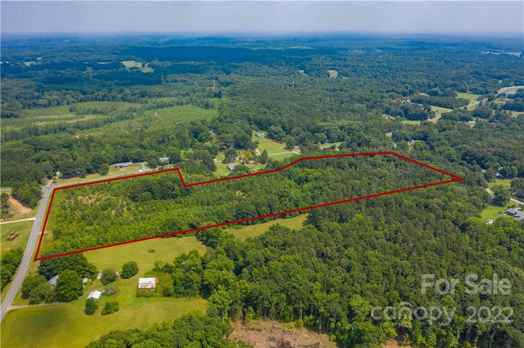 2990 Brantley Road Kannapolis, NC 28083 - Photo 5 of 9 a view of a city with lush green forest