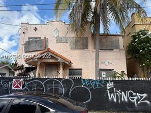 a front view of a house with roof deck